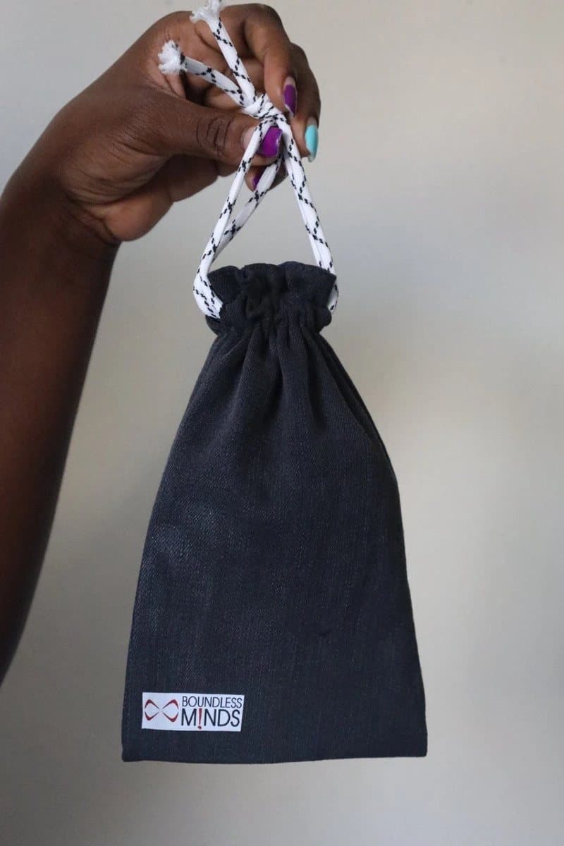 A finished denim jewelry bag
