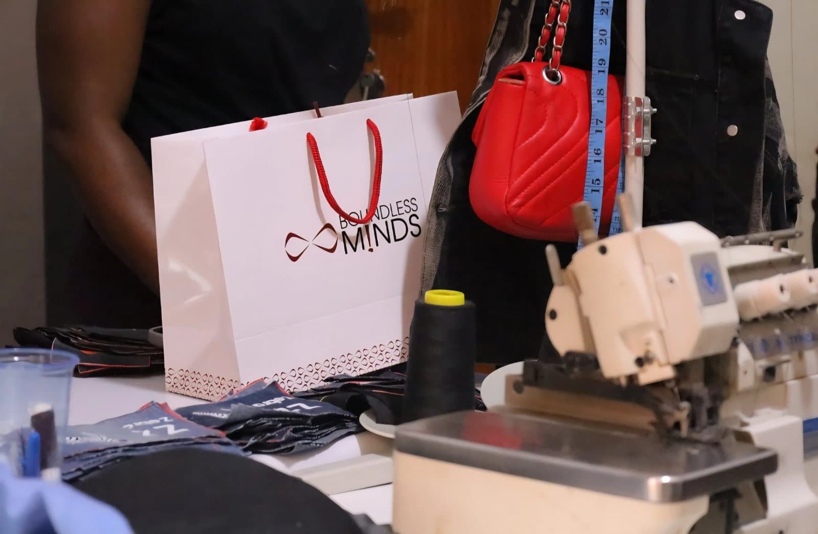 Workbench with a branded Boundless bag, thread and machines